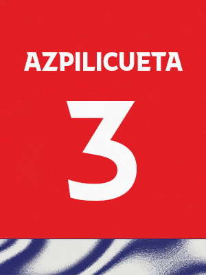Dorsal de color rojo con el nombre 'Azpilicueta' y el número 3 en blanco, sobre un borde inferior con patrón ondulado azul y blanco.