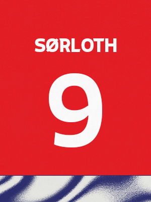 Dorsal de color rojo con el nombre 'Sorloth' y el número 9 en blanco, sobre un borde inferior con patrón ondulado azul y blanco.